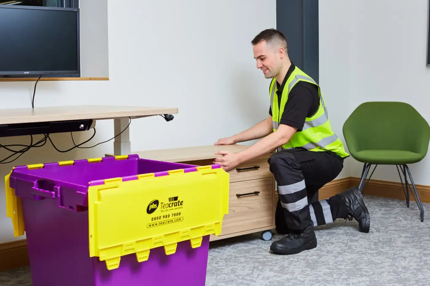 393A7982 A man dragging a small table
