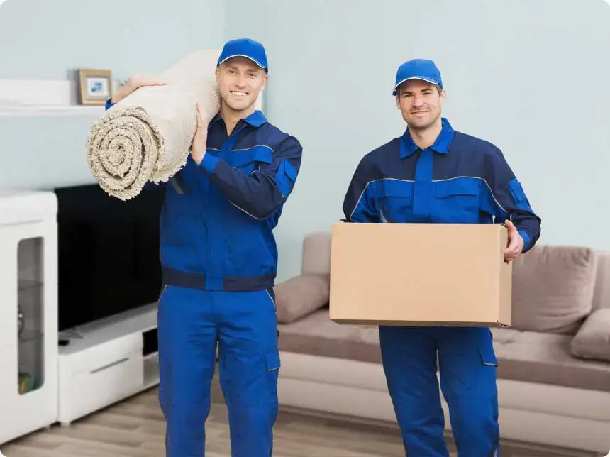 shutterstock_571665037-optimized Two men smiling lifting box and carpet