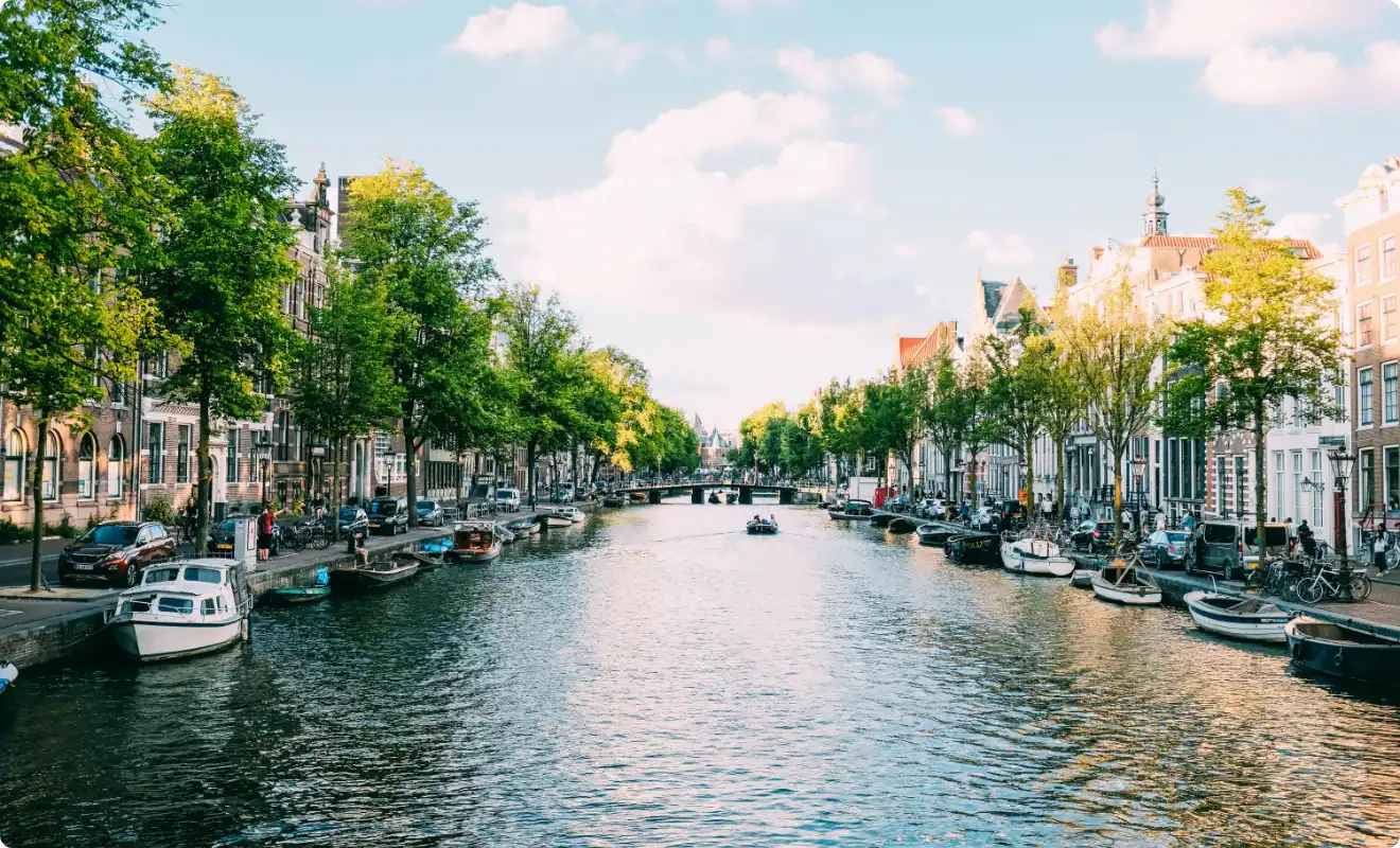 Amsterdam canal with boats Amsterdam canal with boats