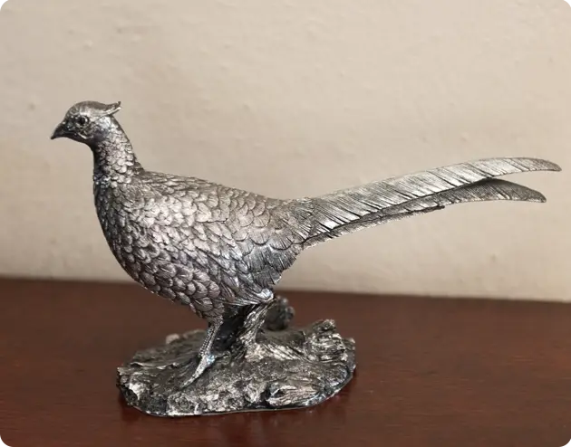 A silver colored bird