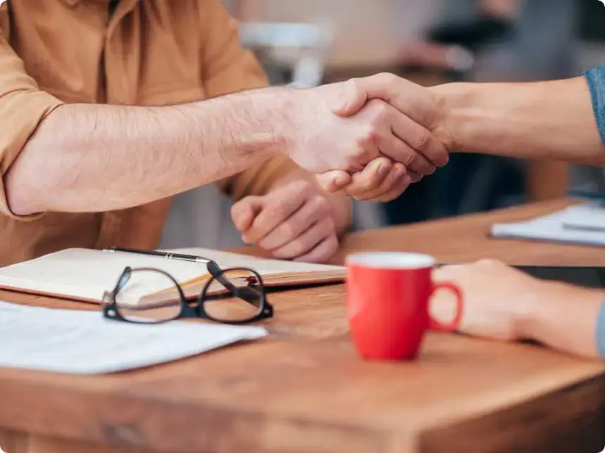shutterstock_345948155-optimized Two people handshaking